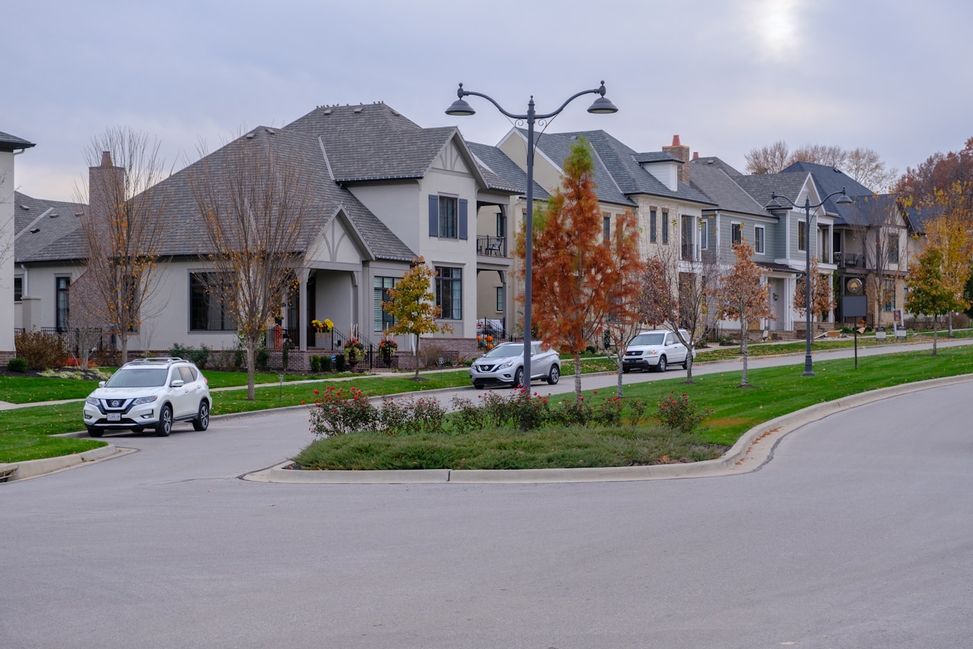 New-construction homes along a landscaped residential street